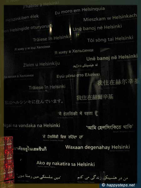 photo of a poster with “I live in Helsinki” in many languages