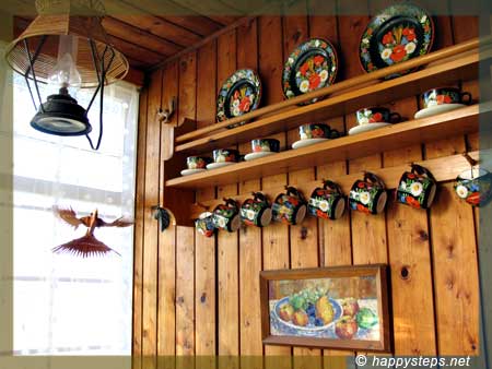 photo of Czech tableware displayed on wooden shelves