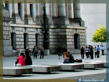 photo of a series of concrete square benches at the rear of the Reichstag building in Berlin